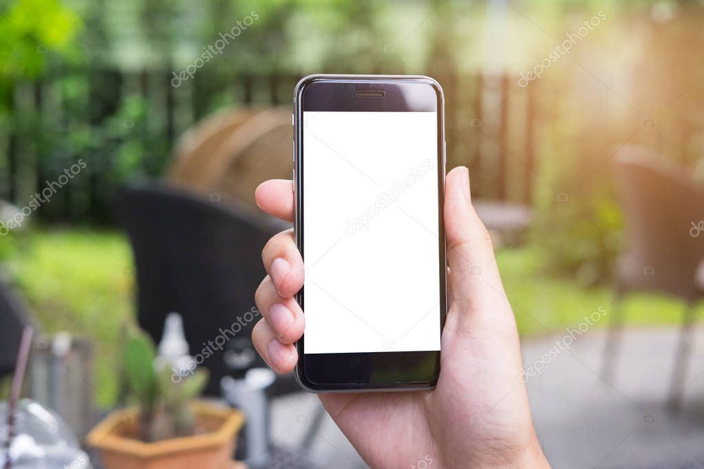 Close up of a man hand holding smart phone with blank screen mob