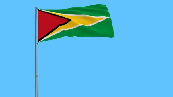 Bandera Guyana Asta Bandera Ondeando Viento Sobre Fondo Azul Puro — Vídeo de stock