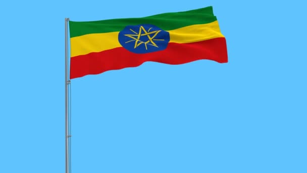 Bandera Etiopía Asta Bandera Ondeando Viento Sobre Fondo Azul Puro — Vídeos de Stock