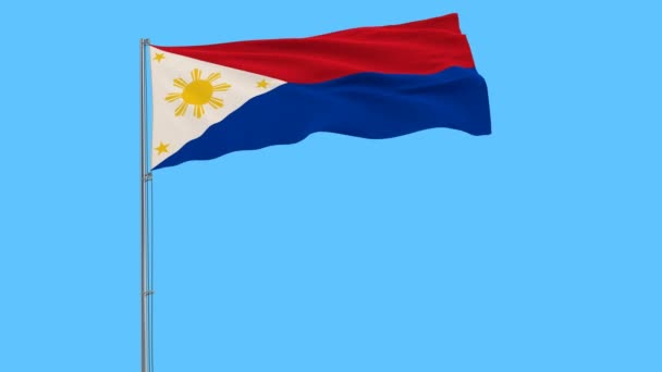 菲律宾国旗在战时对旗杆飘扬在风中的纯蓝色背景 — 图库视频影像