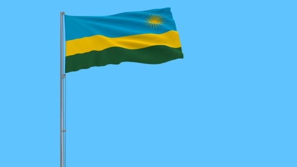 Drapeau du Rwanda sur le mât flottant dans le vent sur fond bleu pur, rendu 3d . — Video