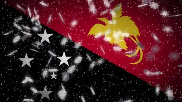 Σημαία Παπουασίας-Νέας Γουινέας που πέφτει χιόνι, Πρωτοχρονιά και Χριστούγεννα φόντο, βρόχος — Αρχείο Βίντεο