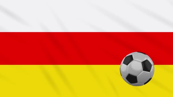 Bandera de Osetia del Sur y pelota de fútbol gira sobre fondo de tela ondulante, bucle — Vídeo de stock
