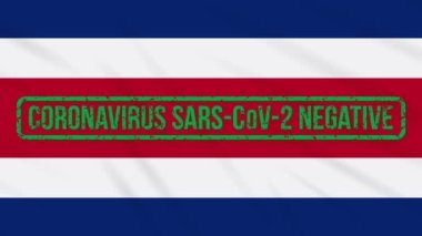 Coronavirüs 'ten yeşil bir damga taşıyan Kosta Rika bayrağı sallanıyor.