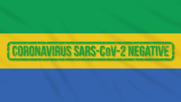 Gabon vajande flagga med grön stämpel av frihet från coronavirus, loop — Stockvideo
