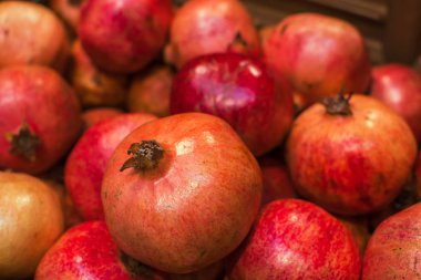 Pomegranate garnet fruit background pattern. Pomegranate whole with flower. Fresh raw organic garnet fruit pile texture background.