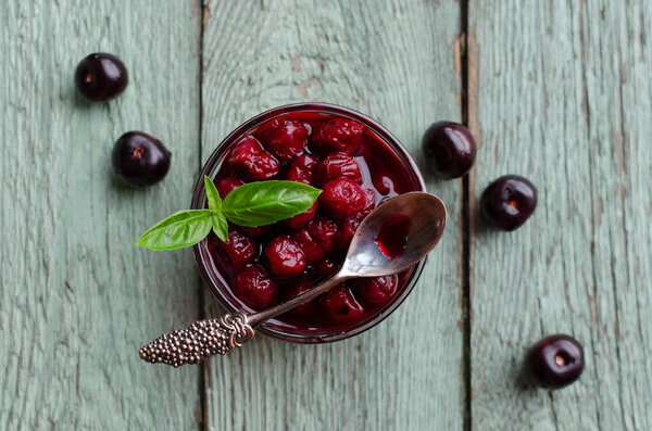 Bowl with cherry jam and fresh cherries in a bowl, homemade preserves, overhead