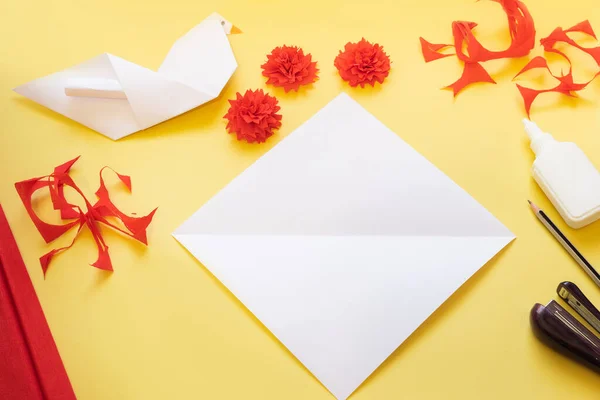 DIY instructions. Step by step. How to make card with carnation flowers and origami dove at home. Card to Victory Day 9 May. Step by step photo instruction. Step 5. Fold a square sheet of paper into a triangle