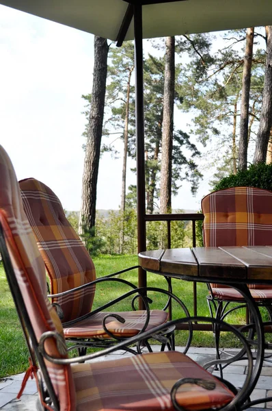 Arbor with forged garden furniture — Stock Photo, Image