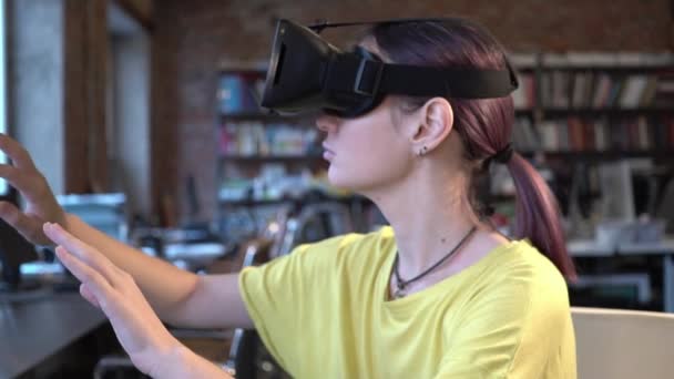 Woman in VR glasses looking up and touch objects — Stock Video