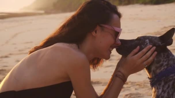 Summer Vacation - Woman with Dog on Beach at Sunrise — Stock Video