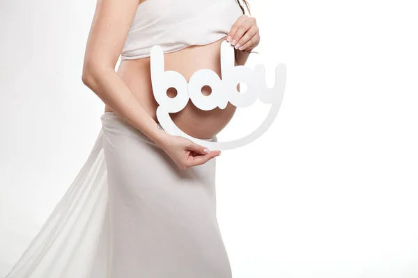 Belly Pregnant Woman White Dress Mother Hands Holding Word Baby — Stock Photo, Image