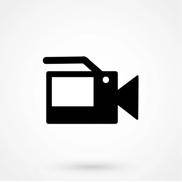 Icono de cámara de vídeo vector de diseño simple sobre un fondo blanco. Ilustración vectorial — Vector de stock
