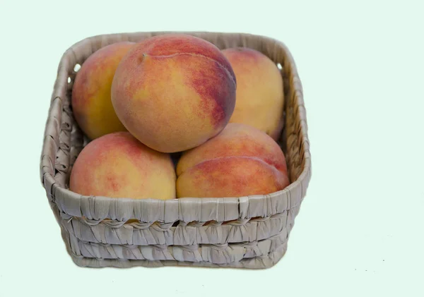 Peach fruit in a basket — Stock Photo, Image