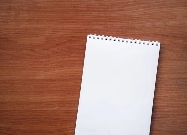 Notebook on a wooden background — Stock Photo, Image