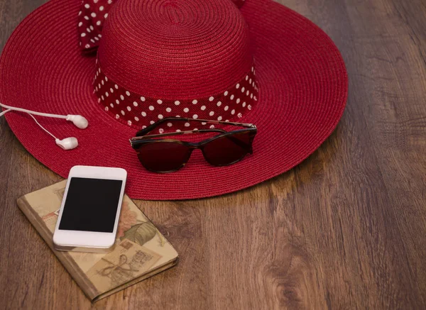 phone and notebook with hat