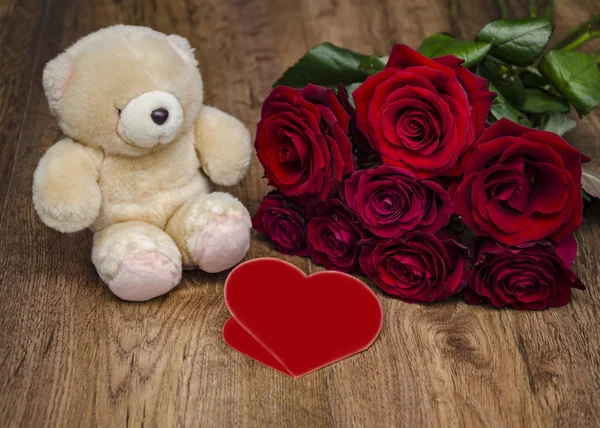soft toy and bouquet of roses