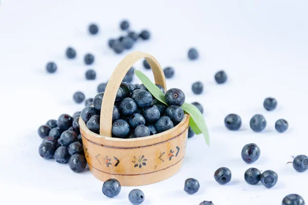 blueberries wild berry in a wooden bowl a slide, raw fortified f