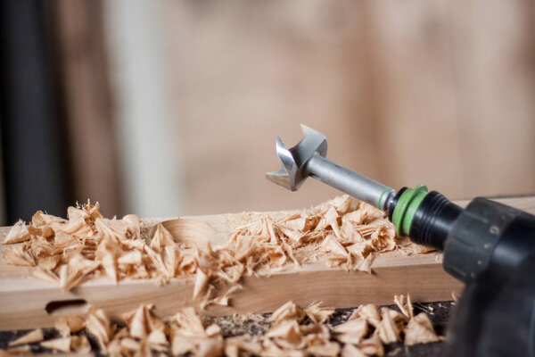 close up photo of drill on work table