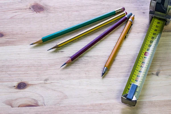 Pencils and ruler on wooden table of carpenter — Stock Photo, Image