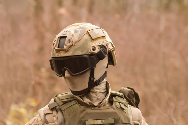 portrait of soldier in mask and helmet