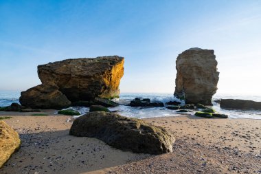 Lanscape of sea cost in sunny day and big rocks 
