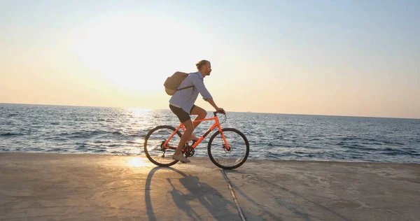 Young Handsome Male Casual Wear Ride Colorful Bicycle Morning Beach — 스톡 사진