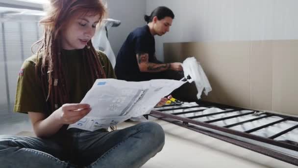 Young Couple Hipsters New Home Assemble Furniture Tattooed Male Redhead — 비디오
