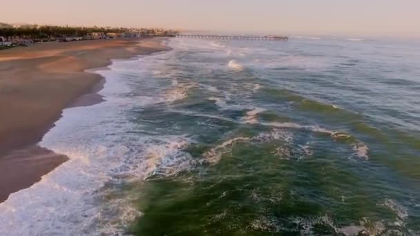 Panorama of the beach area of Swakopmund and a wooden pier. — Stock Video