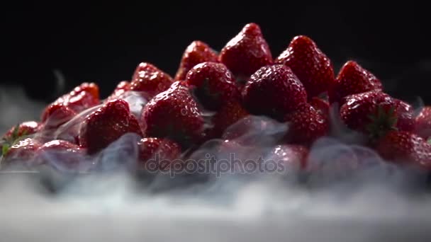 Close-up of a berry on a dark background. — Stock Video