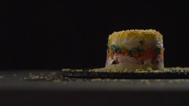 View of the mimosa salad on a dark background. — Stock Video