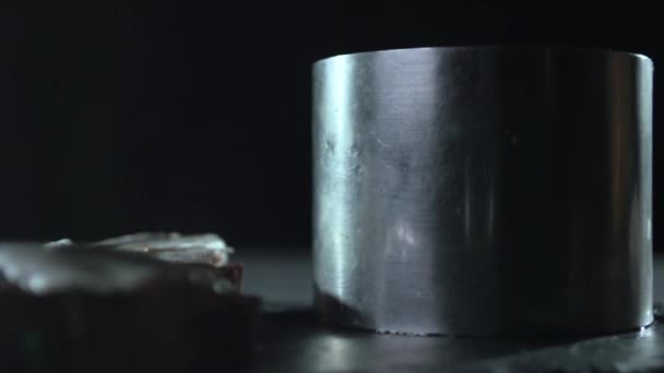 View of a tin cylinder on a black background. — Stock Video