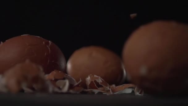The egg shell falls to the surface. — Stock Video