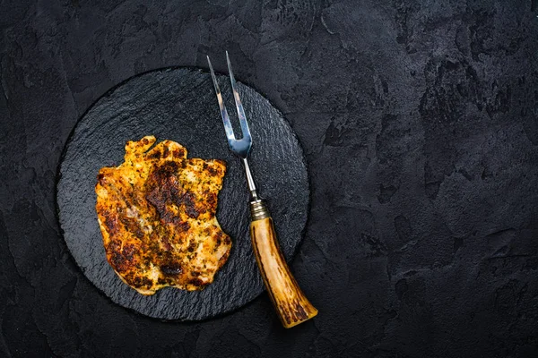 Chicken steak on slate board — Stock Photo, Image