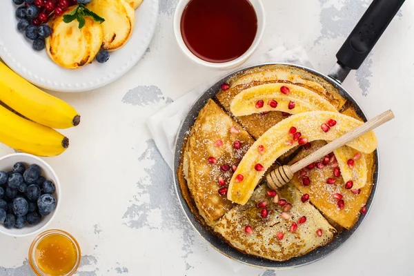 Crepes with pomegranate seeds — Stock Photo, Image