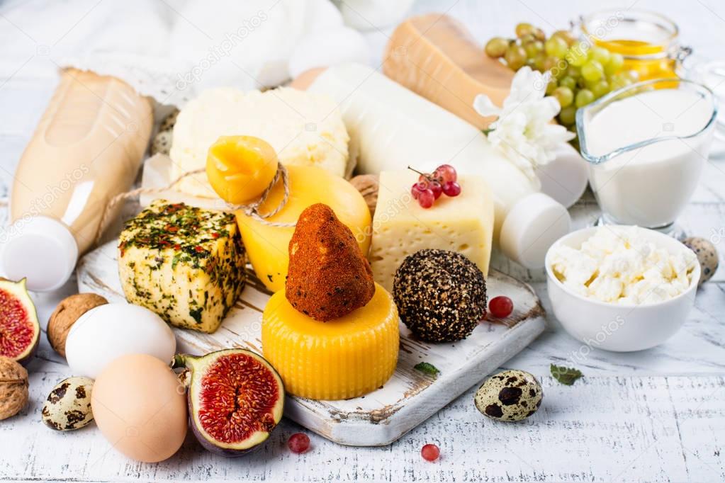 Assortment of dairy farm products on wooden table