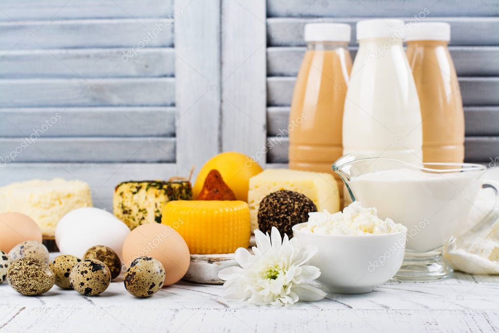 Assortment of dairy farm products on wooden table