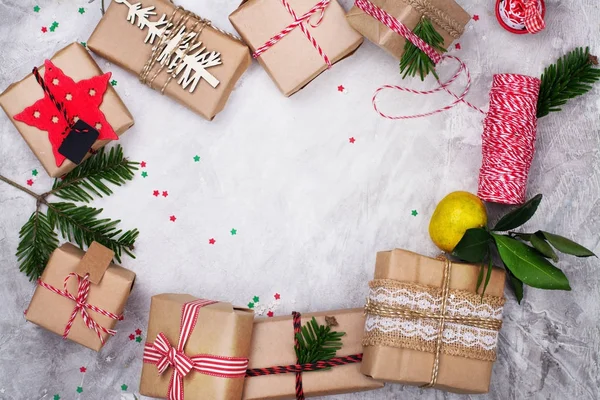 Many Christmas gifts on stone background. Top view — Stock Photo, Image