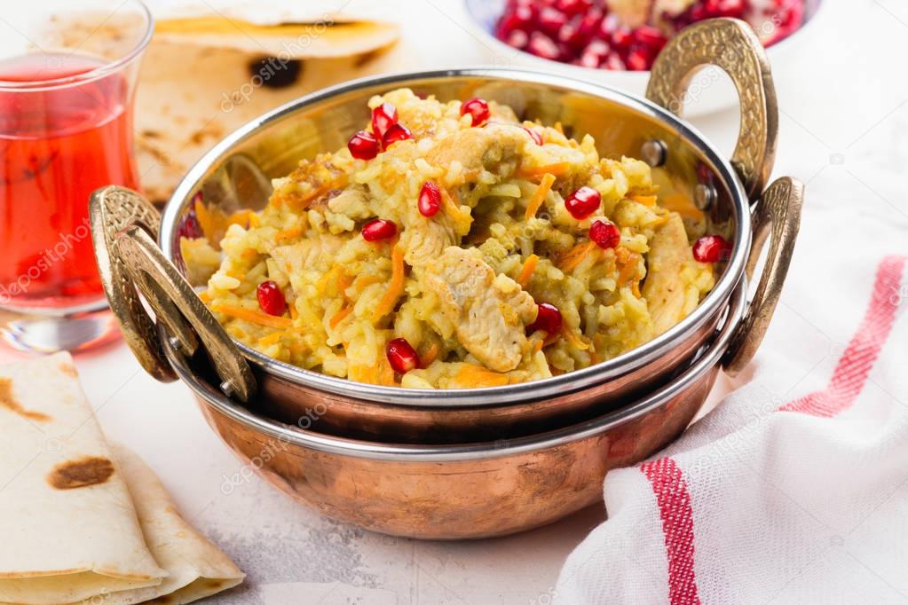 Pilaf with meat and pomegranate seeds