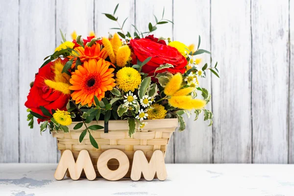Basket with beautiful bright flowers. Mothers day greeting card — Stock Photo, Image