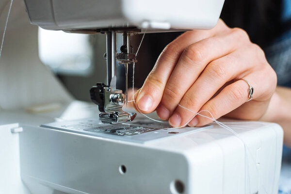 Woman working on sewing machine