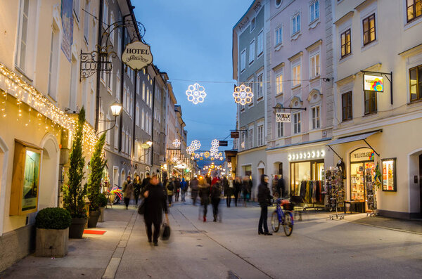 Locals and Tourists Strolling along a Pedestrian Shopping Street in Salzburg City Centre