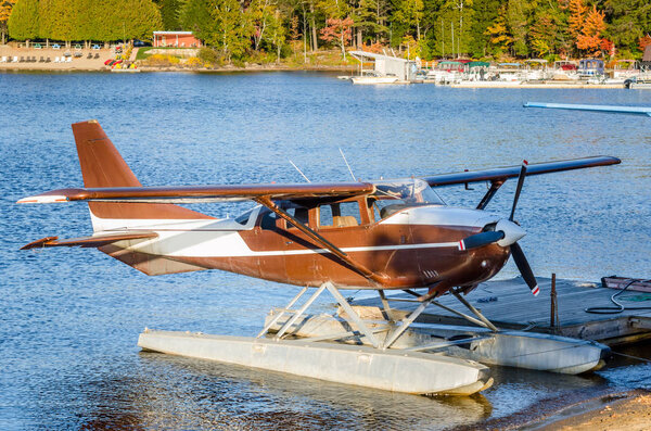 Seaplane Ted up to a Jetty at Sunset
