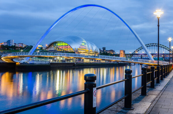 The Gateshead Millennium Bridge with the Tyne Bridge in Background. Newcastle upon Tyne, UK.