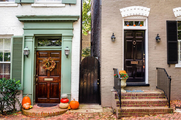 Traditional Wooden Front Doors of Old Colourful Buildings with Red Brick Steps. Old Town Alexandria, VA, USA.