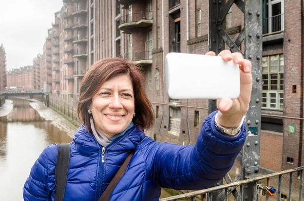 Woman Tourist  Smiling and Taking a Selfie