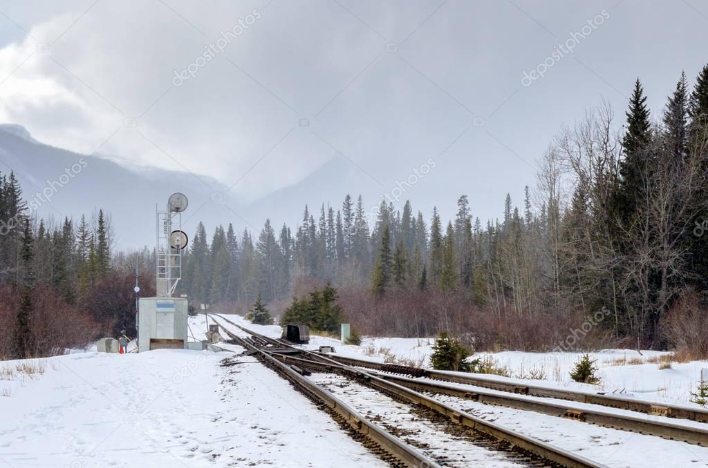 Railroad Switch and Signal on a Foggy Winter Day