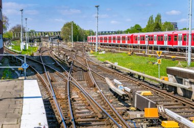 Railway Tracks at a Train Station and Blue Sky clipart