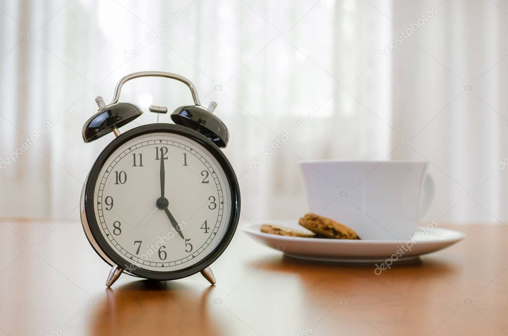 Vintage Alarm Clock on Wooden Table