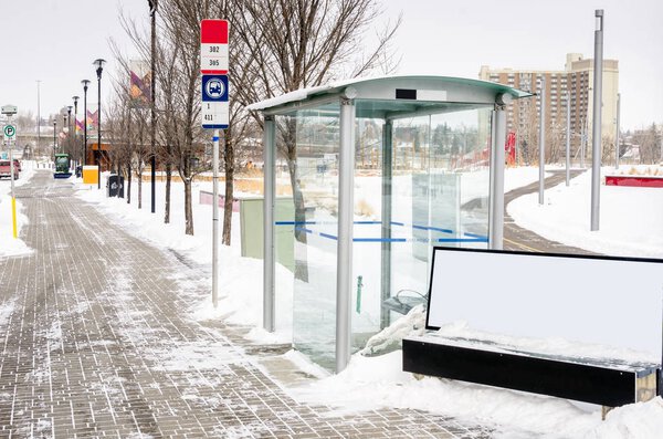Bus Stop with a Glass Shelter Calgary, Canada, on a Snowy Winter Day